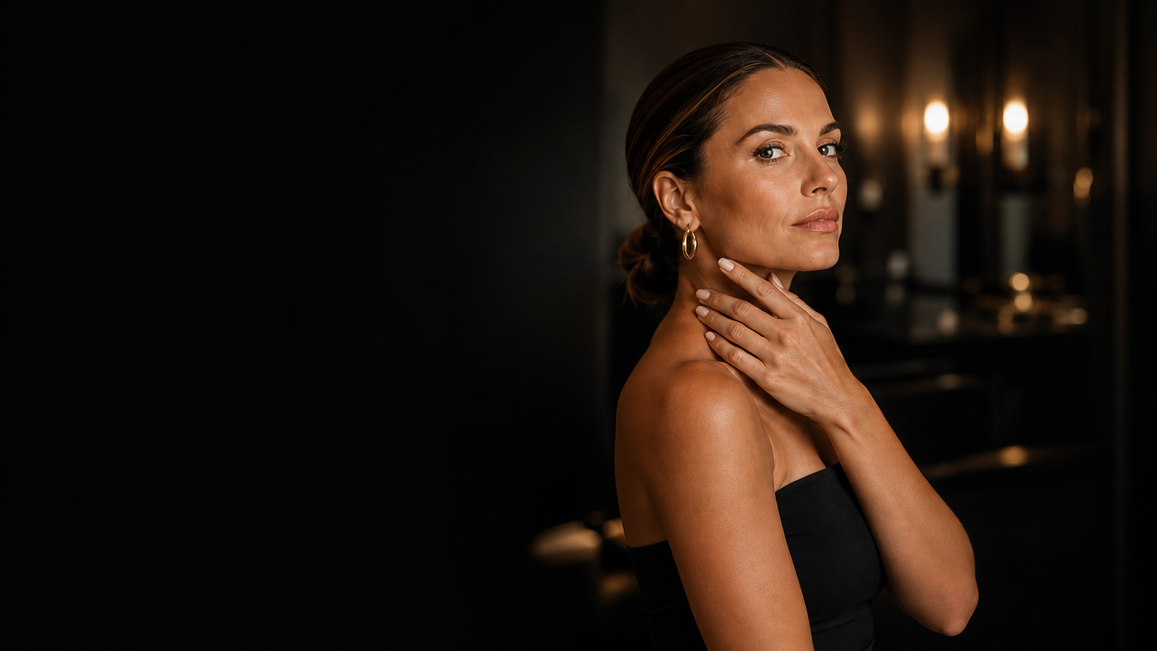 Woman with radiant skin in a luxury aesthetics studio